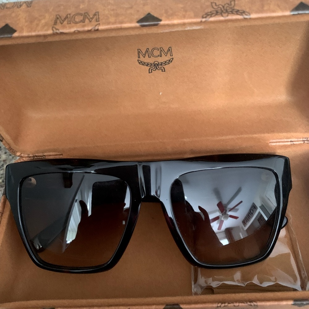 New MCM sunglasses with leather box and dust cloth.